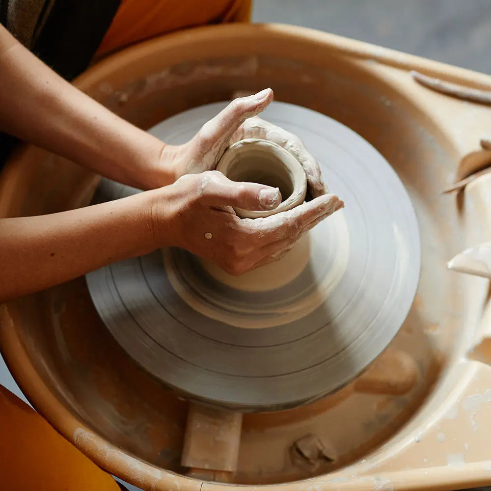 hands-shaping-ceramics-on-pottery-wheel hands-shaping-ceramics-on-pottery-wheel